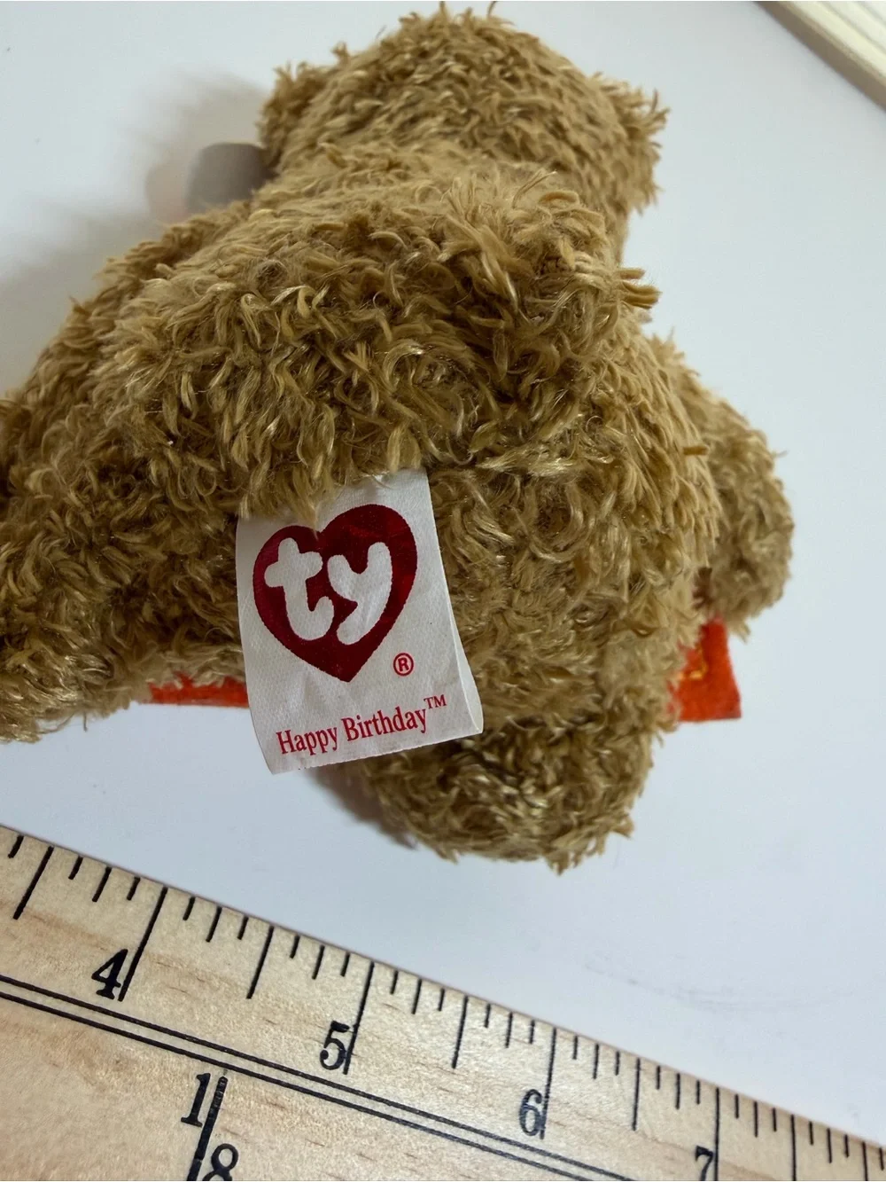 Ty Brown Beanie Baby Teddy Holding Colorful Birthday Banner Plush